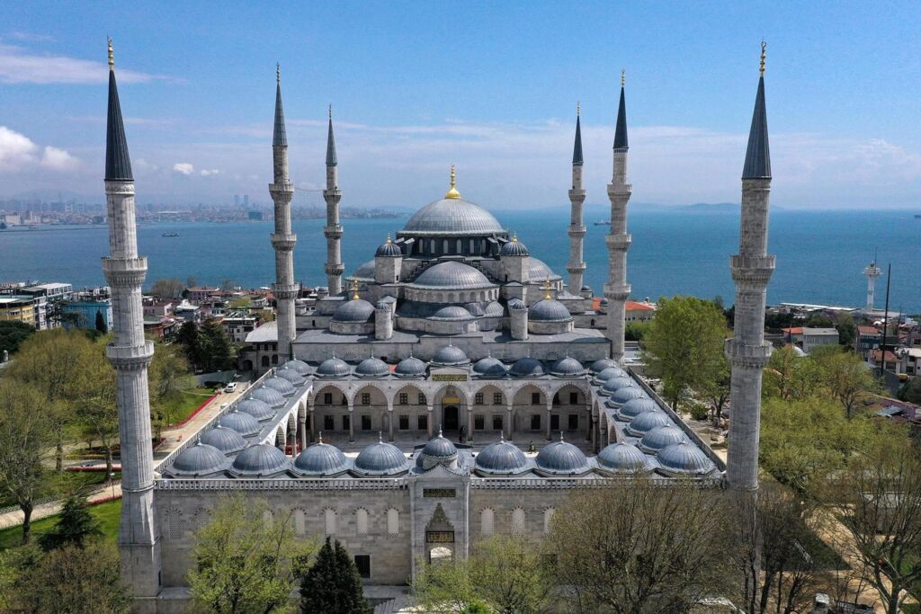 View of the Blue Mosque in Istanbul with the Bosphorus Strait in the background.