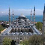 View of the Blue Mosque in Istanbul with the Bosphorus Strait in the background.
