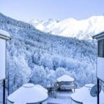 Snowy yurts and winter forest at Mountain View Resort in Alamedin Gorge, Kyrgyzstan.