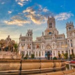 Palacio de Cibeles at sunset with the Cibeles Fountain in Madrid.