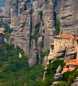Meteora Monastery Stunning view of a Meteora monastery perched atop towering rock formations, with dramatic cliffs and a serene sky in the background, showcasing the unique landscape of central Greece.