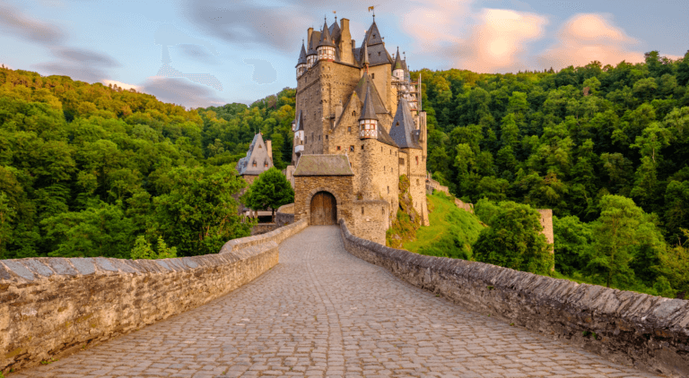 Scenic view of Germany, featuring picturesque landscapes such as rolling hills, lush forests, and traditional half-timbered houses, with historic castles and charming villages in the background, under a clear sky.